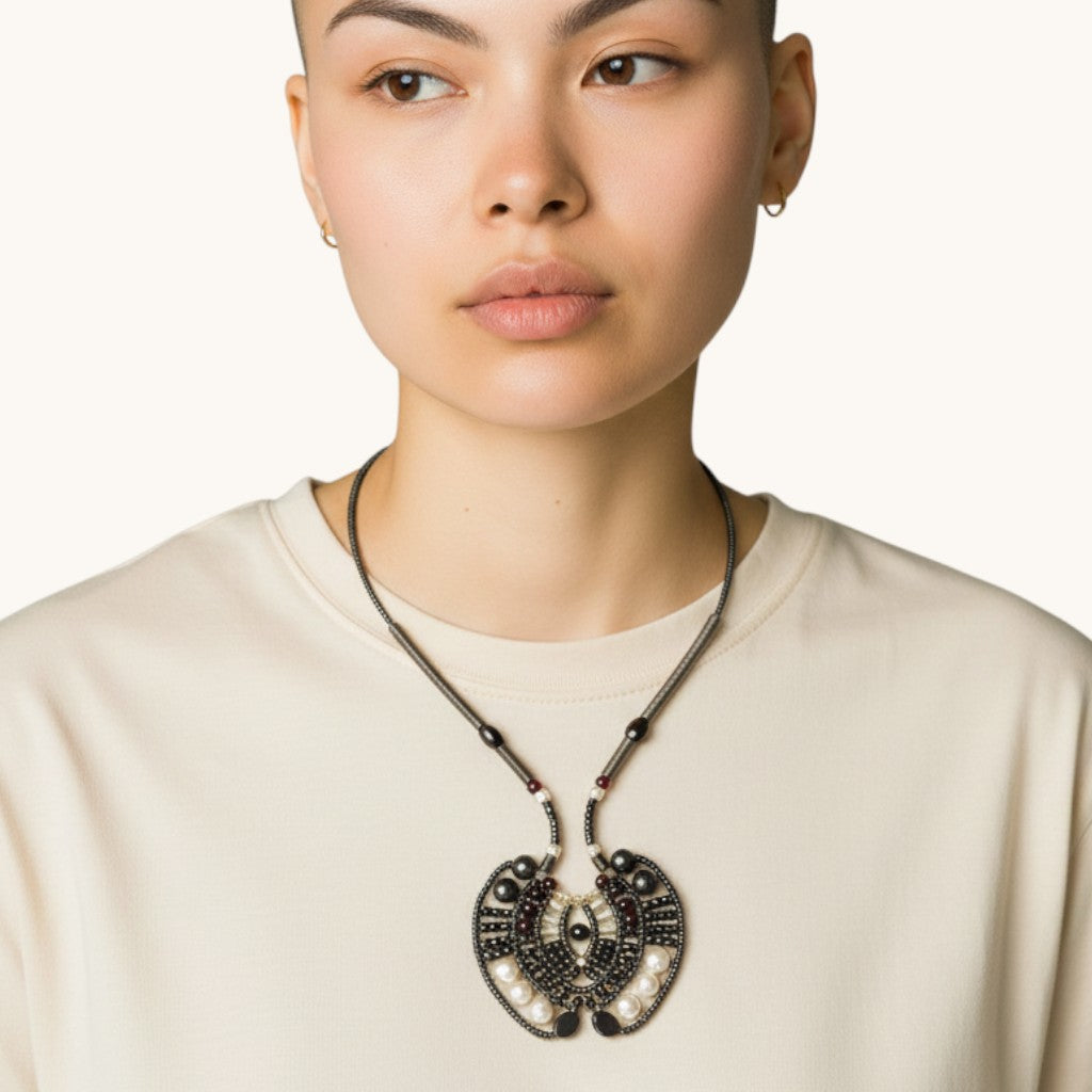 Trebor Style Ziio Aki pendant necklace featuring black onyx, garnet, and white pearls on a model.