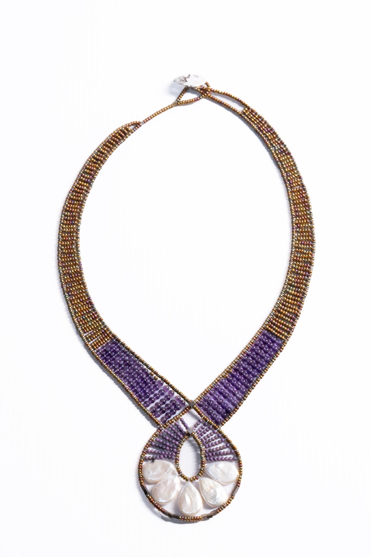 Trebor Style Ziio Ariane necklace featuring a Mother of Pearl fan pendant, Amethyst beads, and Murano glass accents.