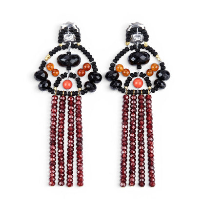 Trebor Style Ziio long tassel earrings featuring black tourmaline, coral glass beads, and rust red zircon gems.