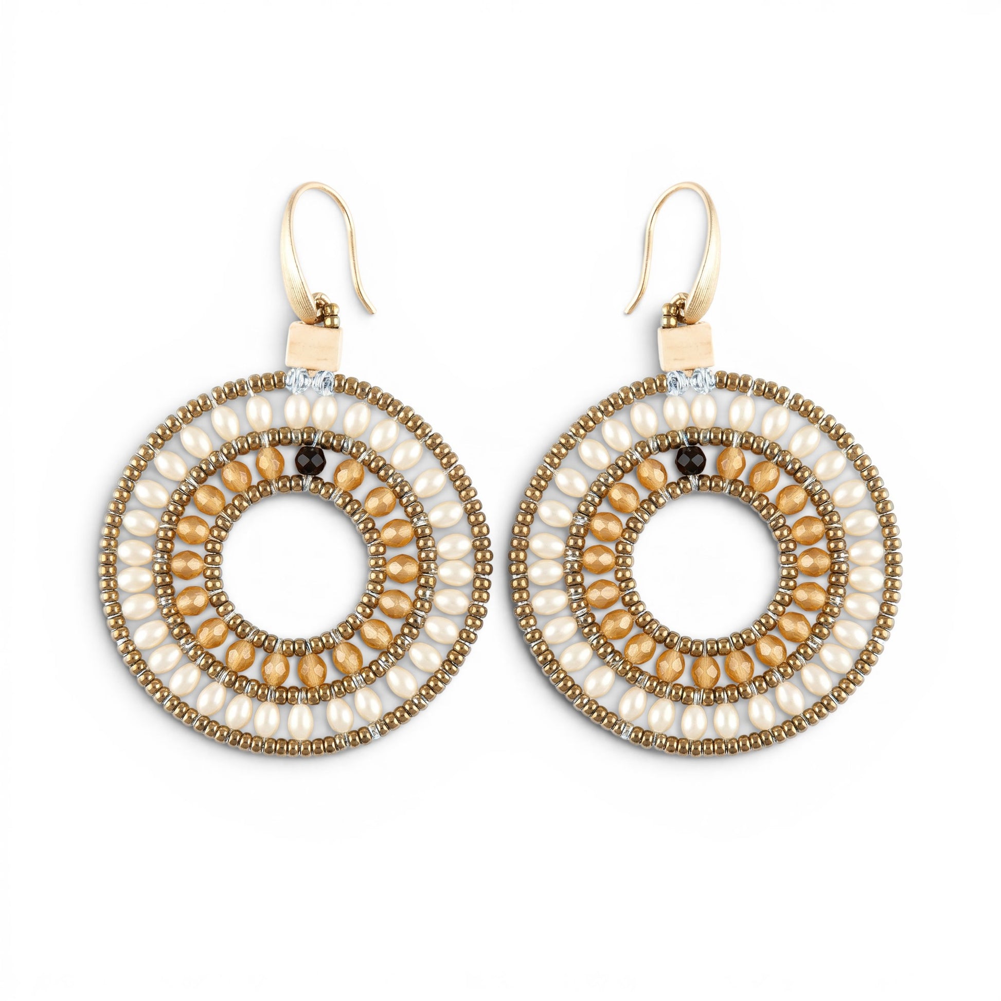 Trebor Style Ziio O earrings featuring orange carnelian, cream pearls, and gold Murano glass beads on circular frames.