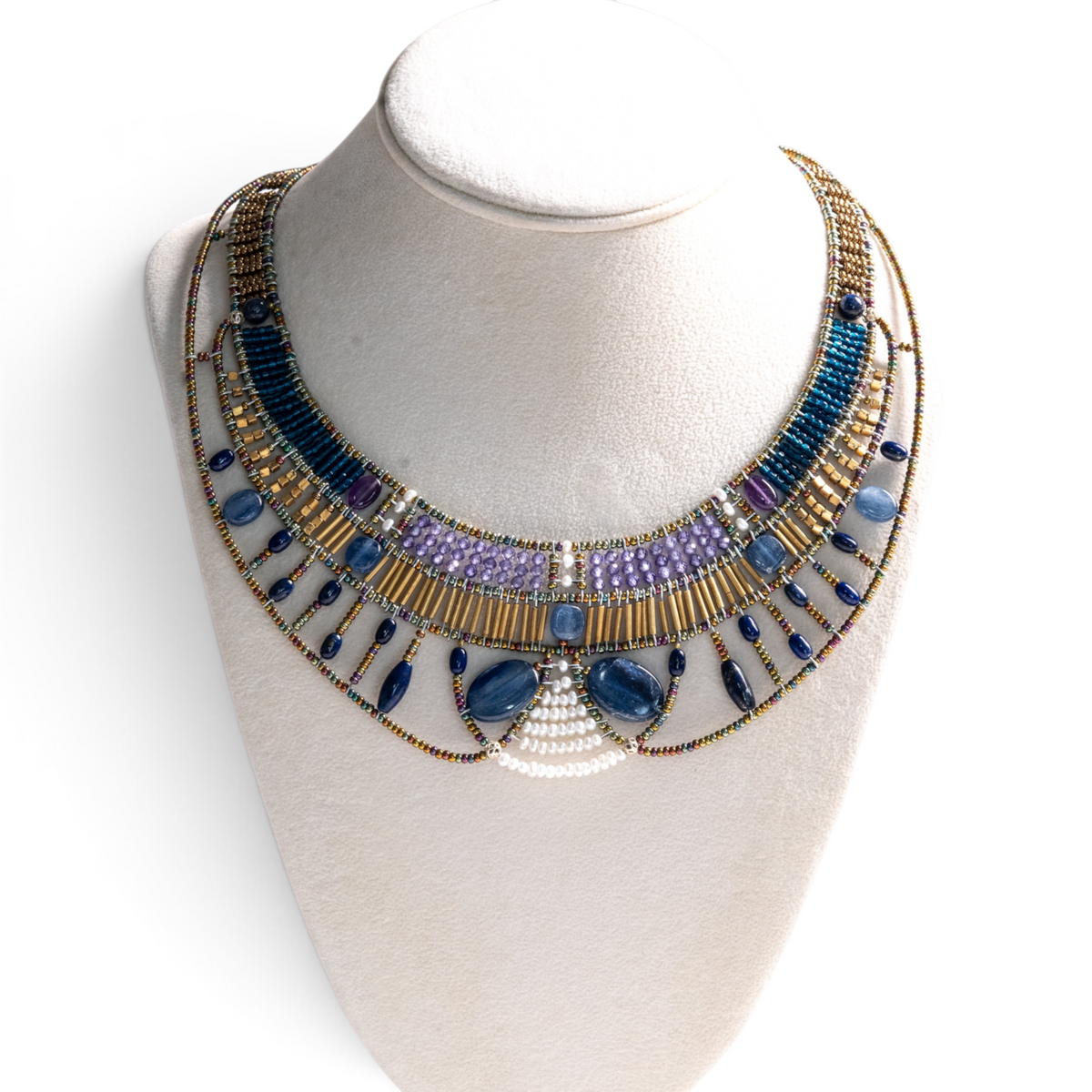 Trebor Style Ziio Doree statement necklace featuring blue kyanite, amethyst, pearls, and Murano glass beads on a bust.