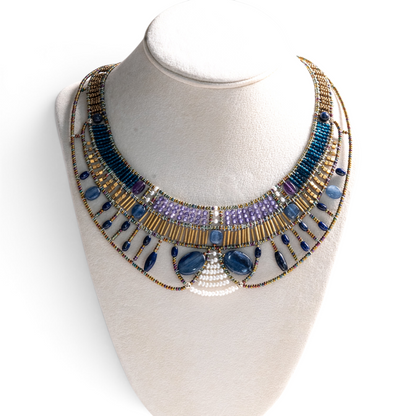 Trebor Style Ziio Doree statement necklace featuring blue kyanite, amethyst, pearls, and Murano glass beads on a bust.