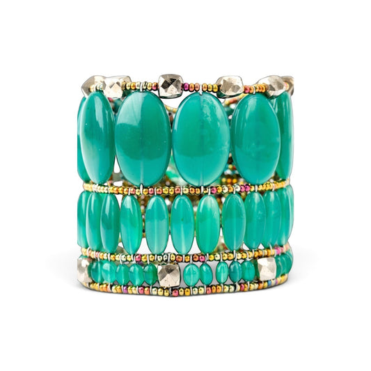 Trebor Style Ziio cuff bracelet featuring vibrant oval green onyx gemstones, pyrite beads, and Murano glass accents.