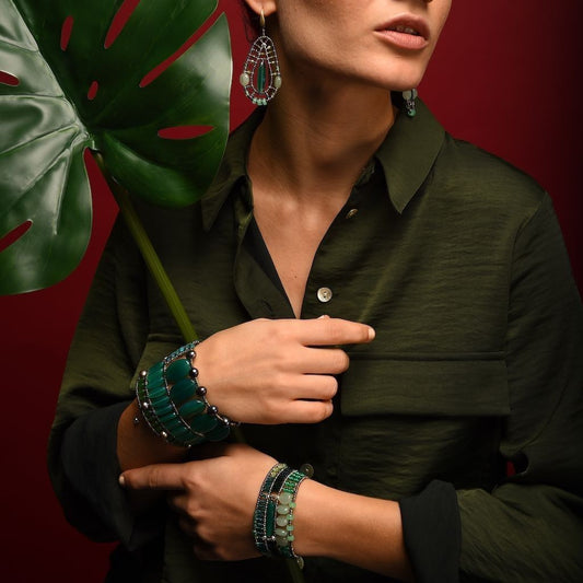 Trebor Style Ziio Ovale cuff bracelet featuring green onyx gemstones, pyrite beads, and murano glass on a model