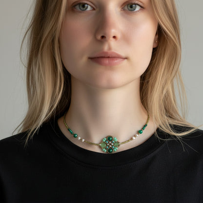 Trebor Style Ziio Knott necklace featuring green malachite and chrysoprase gemstones with a central flower knot design.