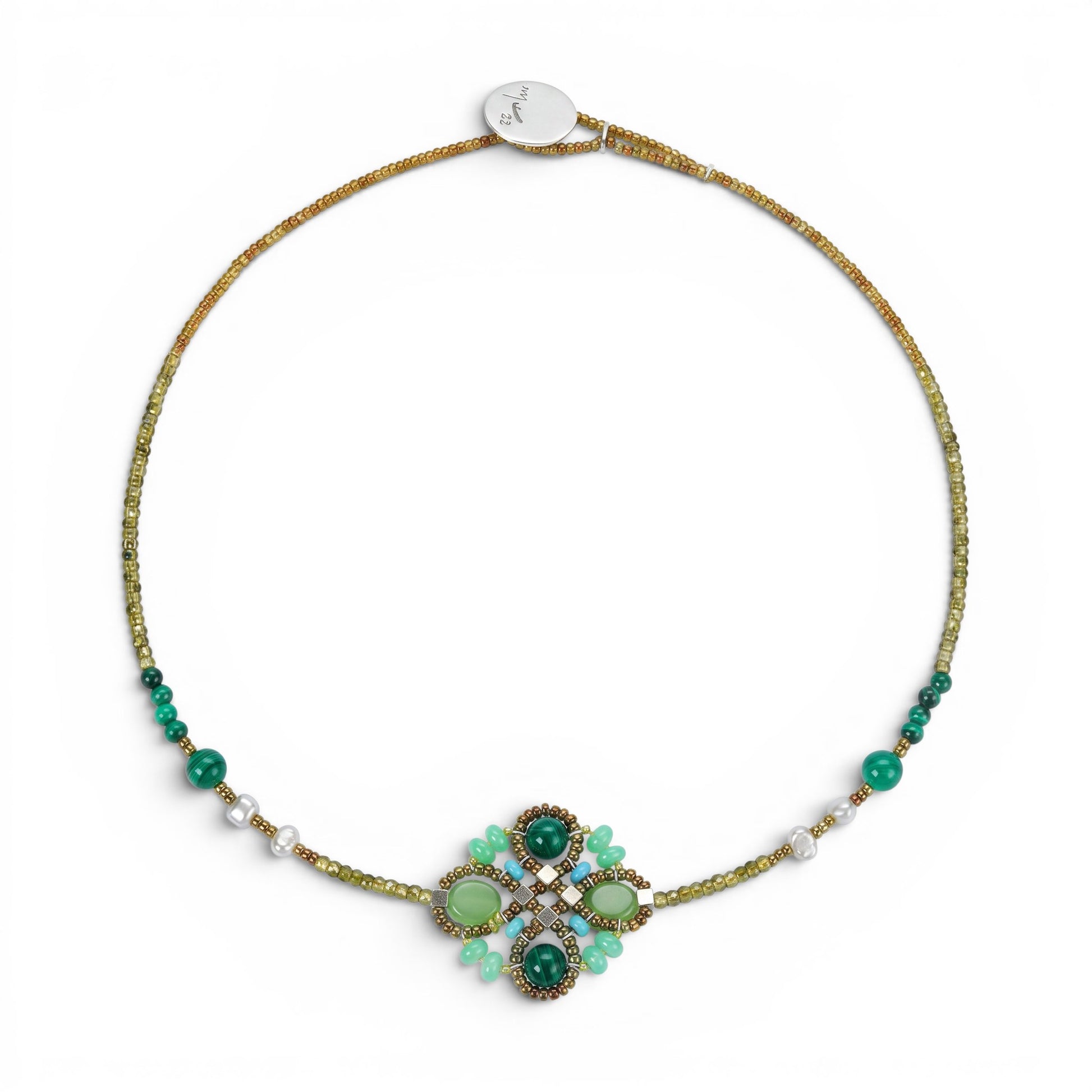 Trebor Style Ziio Knott necklace featuring green malachite, chrysoprase, and zircon gemstones with Murano glass beads.