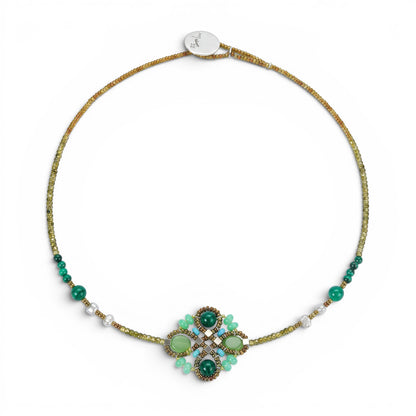 Trebor Style Ziio Knott necklace featuring green malachite, chrysoprase, and zircon gemstones with Murano glass beads.