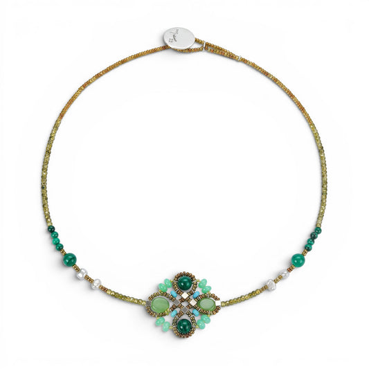 Trebor Style Ziio Knott necklace featuring green malachite, chrysoprase, and zircon gemstones with Murano glass beads.