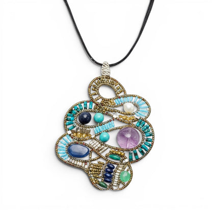 Trebor Style Ziio Mamba pendant necklace featuring turquoise, kyanite, lapis, amethyst, and pearl on a velvet cord.