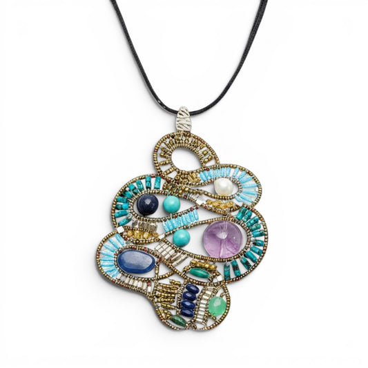 Trebor Style Ziio Mamba pendant necklace featuring turquoise, kyanite, lapis, amethyst, and pearl on a velvet cord.