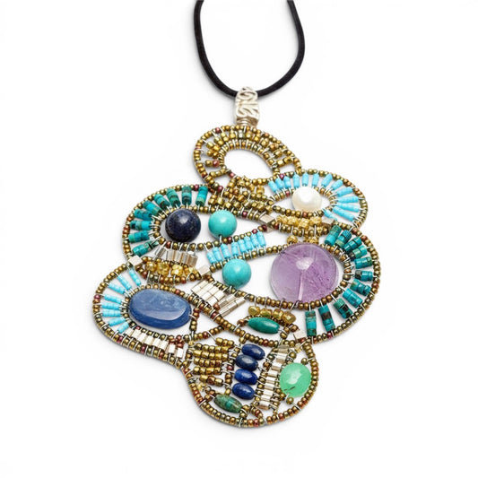 Trebor Style Ziio Mamba pendant necklace with turquoise, kyanite, lapis, amethyst, and pearl on a silk velvet cord.