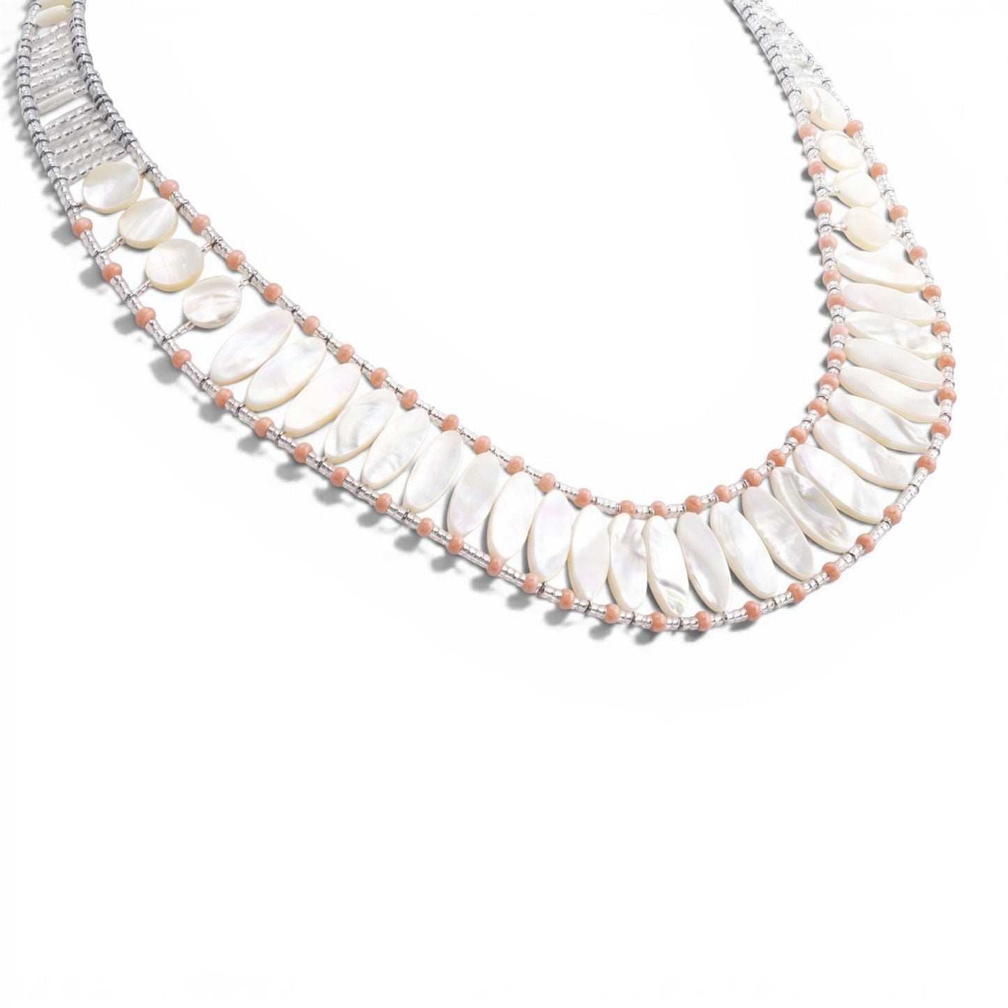 Trebor Style Ziio handcrafted necklace featuring white mother of pearl, pink coral beads, and sterling silver closure.