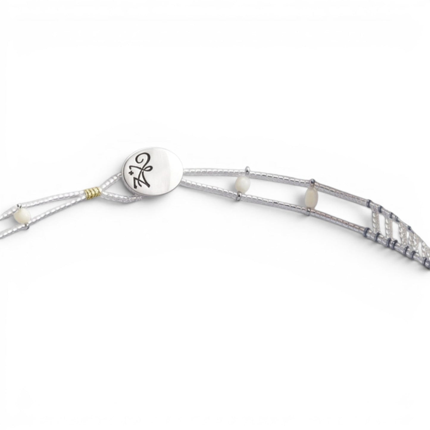 Trebor Style Ziio handcrafted necklace featuring white mother of pearl, pink coral beads, and sterling silver closure.