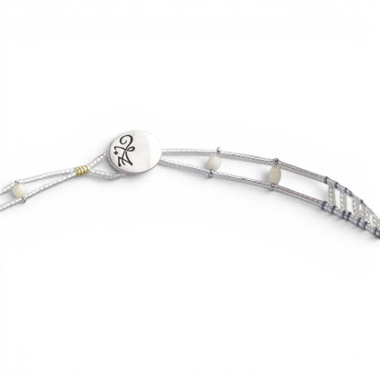Trebor Style Ziio handcrafted necklace featuring white mother of pearl, pink coral beads, and sterling silver closure.