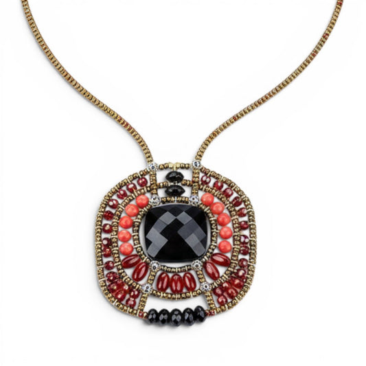 Trebor Style Ziio pendant necklace featuring a central black onyx, red garnet, coral, and Murano glass beads.