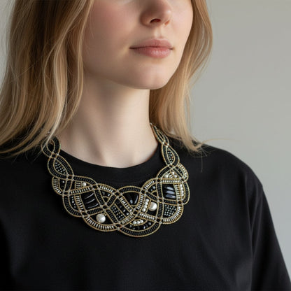 Trebor Style Ziio New Romance bib necklace featuring black onyx, white pearls, and silver beads on a model.