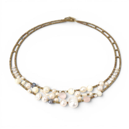 Trebor Style Ziio Shinju necklace featuring white pearls, pink morganite, and golden Murano glass beads on steel wire.