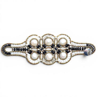 Trebor Style Ziio cuff bracelet featuring large white baroque pearls, black onyx, tourmaline, and Murano glass beads.