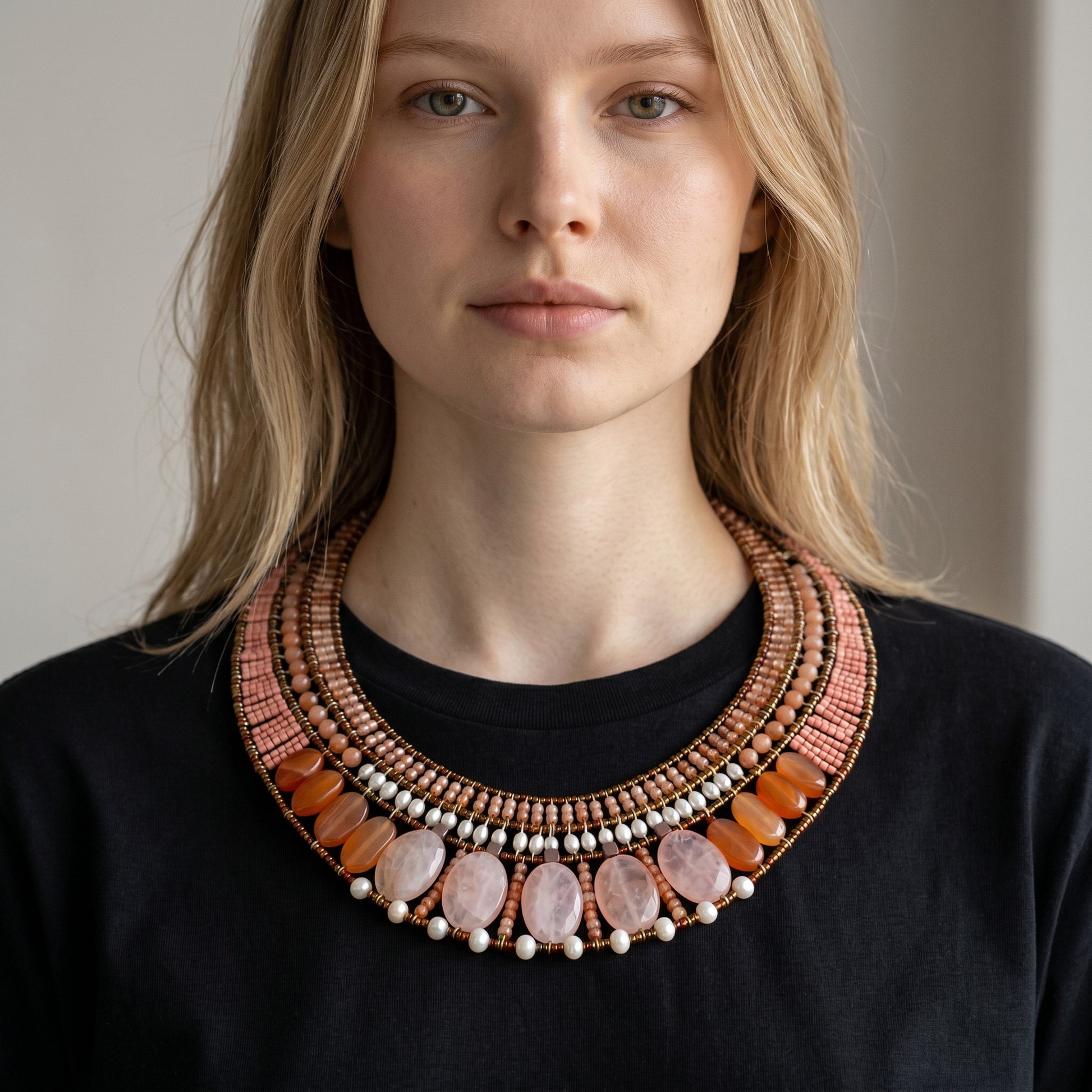 Trebor Style Ziio statement necklace featuring pink morganite, moonstone, zircon, and pearls on a model.