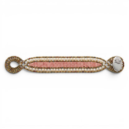 Trebor Style Ziio Dami cuff bracelet featuring pink howlite beads, white seed pearls, and a sterling silver button clasp.
