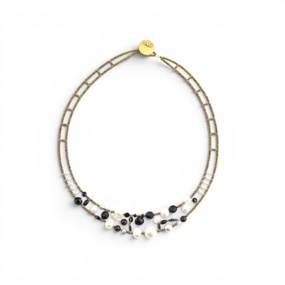 Trebor Style Ziio Shinju necklace featuring black onyx, white pearls, and red garnets on gold Murano glass bead wire.