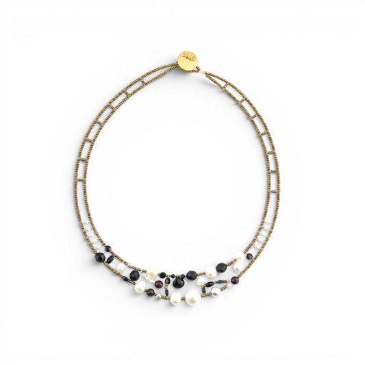 Trebor Style Ziio Shinju necklace featuring black onyx, white pearls, and red garnets on gold Murano glass bead wire.