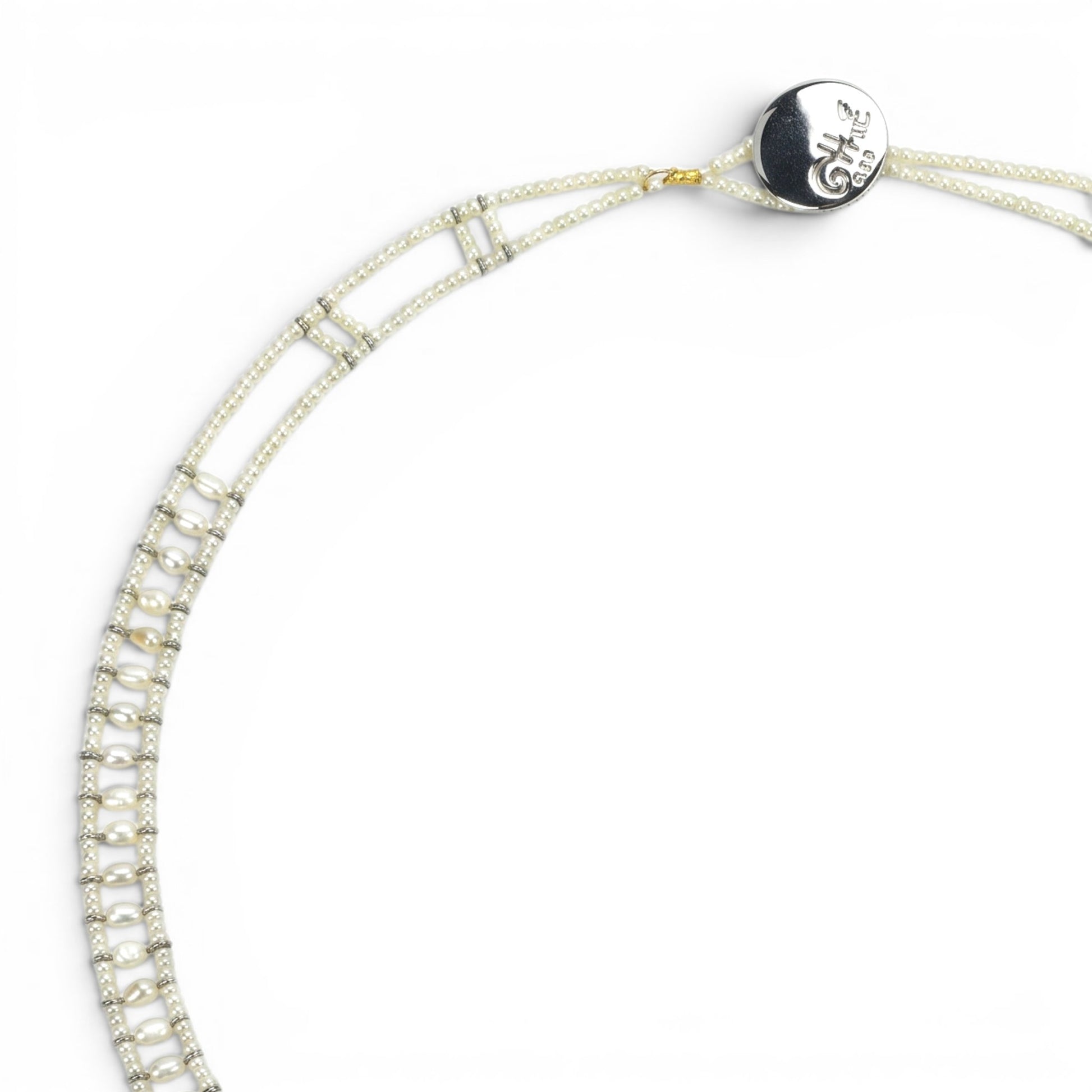 Trebor Style Ziio white pearl necklace with Murano glass beads and a central sterling silver pendant on white background
