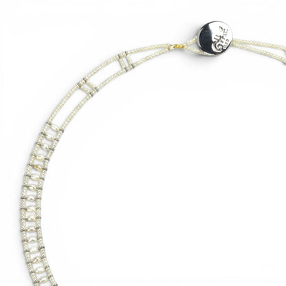 Trebor Style Ziio white pearl necklace with Murano glass beads and a central sterling silver pendant on white background